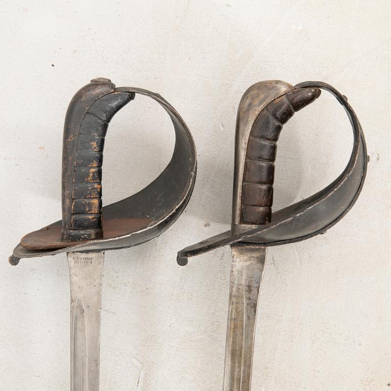 Two Swedish practice swords, 1886 pattern.