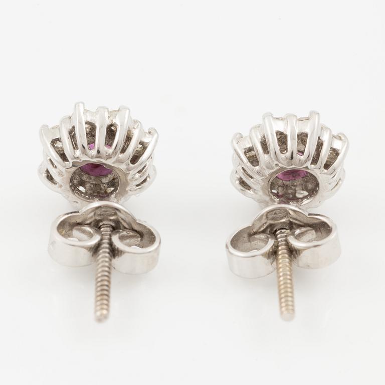 Pendant with gold chain, 
Pendant with white gold chain, 
Earrings a pair, rubies with brilliant-cut diamonds.