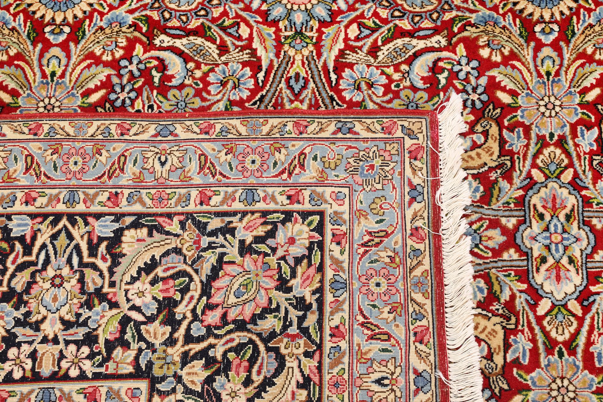 A Kirman lavar carpet, 403 x 304 cm.