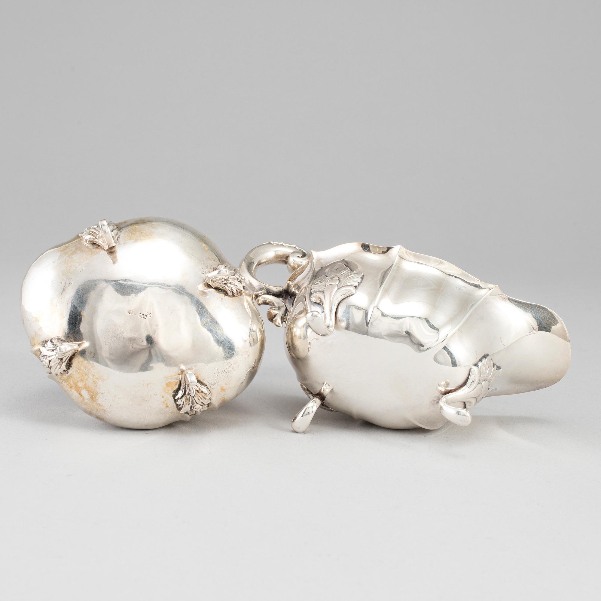 A rococo-style 20th century silver cream-jug and sugar-box, Swedish import marks.