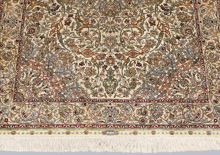 An Oriental silk rug, approx. 153 x 95 cm.