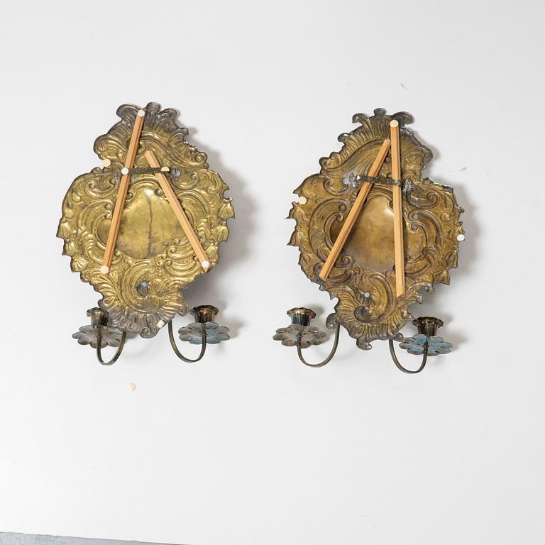 A pair of Rococo-style silver-plate sconces, early 20th century.