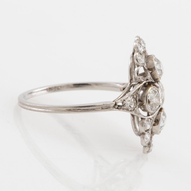 Platinum ring set with round old-cut diamonds, early 20th century.