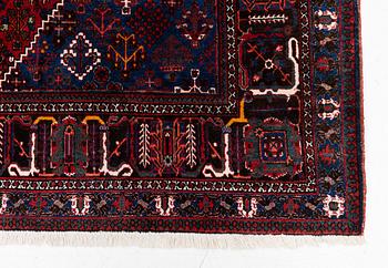 An oriental rug, c. 365 x 285 cm.