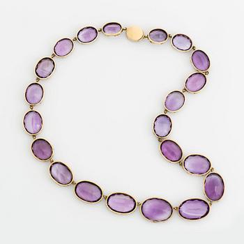 A 14K gold and amethyst necklace.