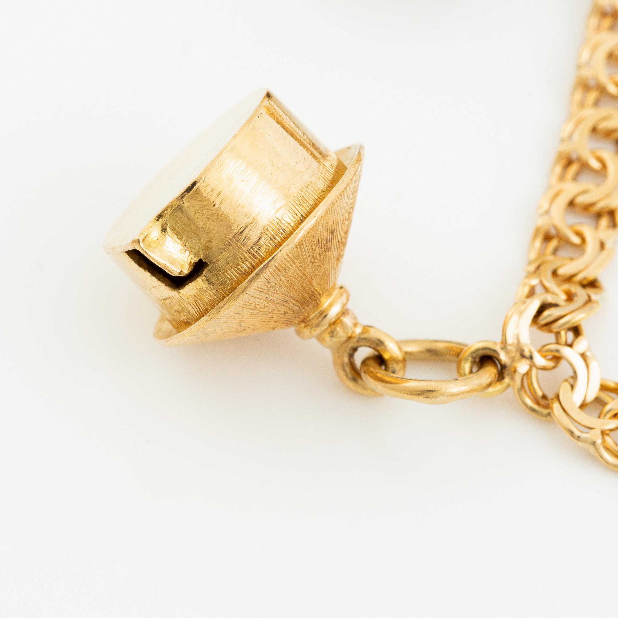 Bracelet, 18K gold bismarck link. With charms.