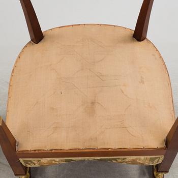 A pair of early 20th century Empire style armchairs.