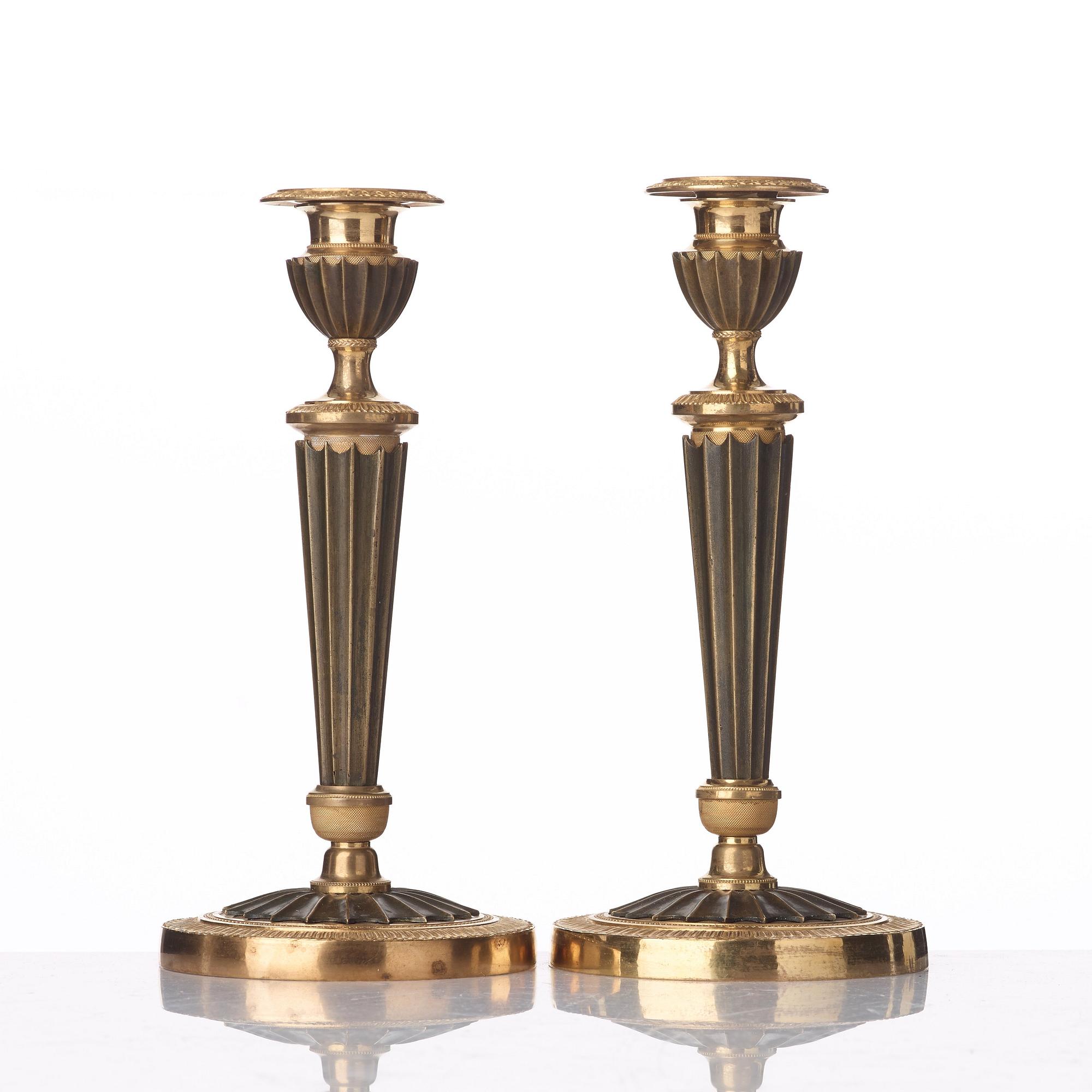 A pair of French Empire early 19th century candlesticks.
