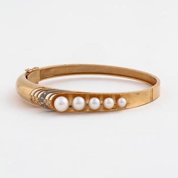 A cultured pearl and single cut diamond bangle by Svedboms, Vetlanda, 1968.