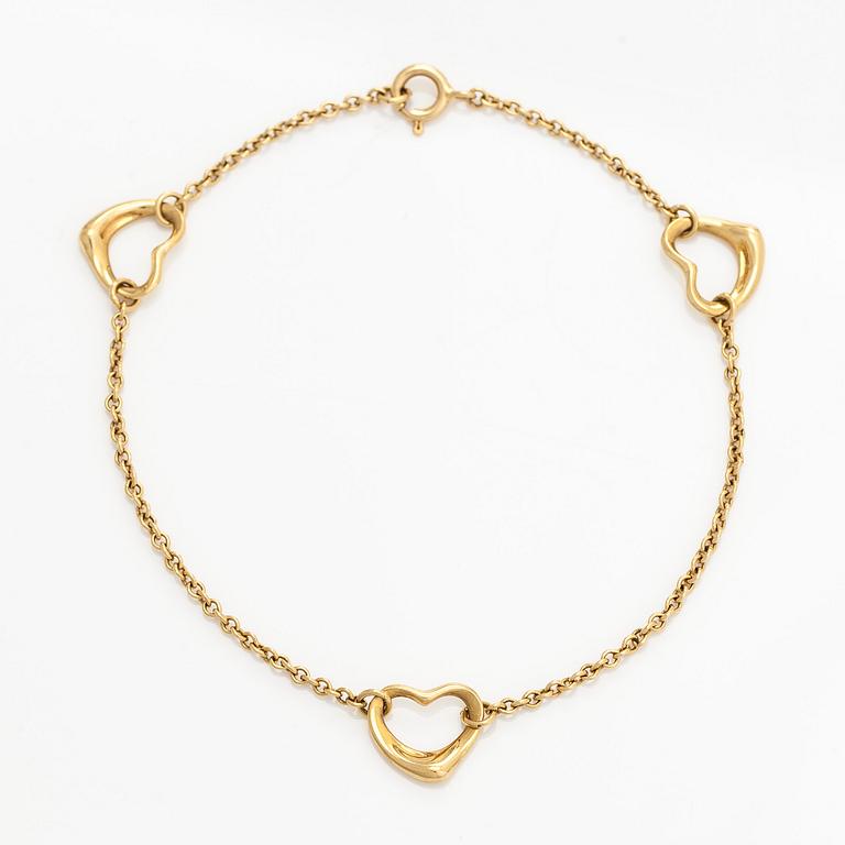 Tiffany & Co, an 18K gold 'Open Heart' bracelet.