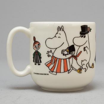 A Moomin characters porcelain mug and a plate 'Happy family' Arabia 1995-2001.