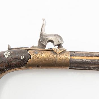 A British percussion pistol, 19th century.