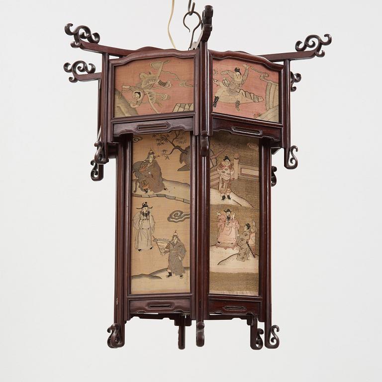 A lantern with panels of kesi woven silk, Qing dynasty, circa 1900.