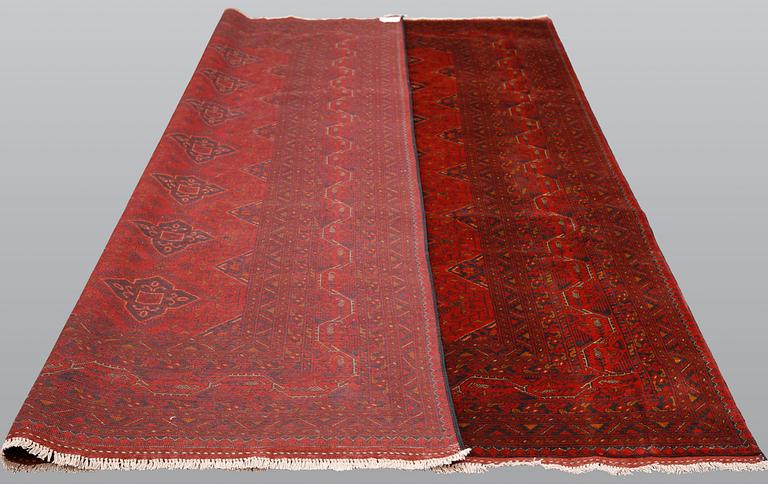 An Afghan carpet, 343 x 243 cm.