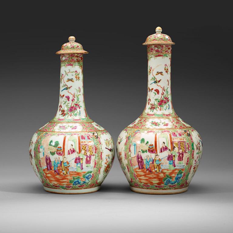 A pair of famille rose Canton vases with covers, Qing dynasty, 19th Century.