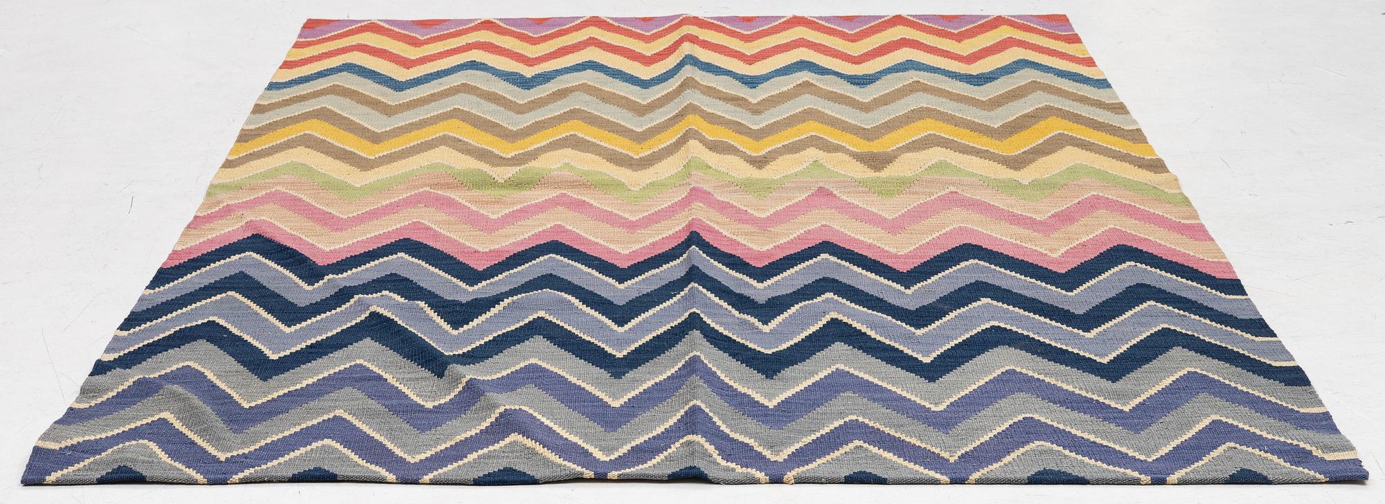 A flat-woven rug, c. 240 x 170 cm.