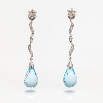 A pair of 18K white gold earrings with topazes and diamonds ca. 0.37 ct in total.