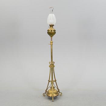 A floor brass paraffin lamp around 1900.