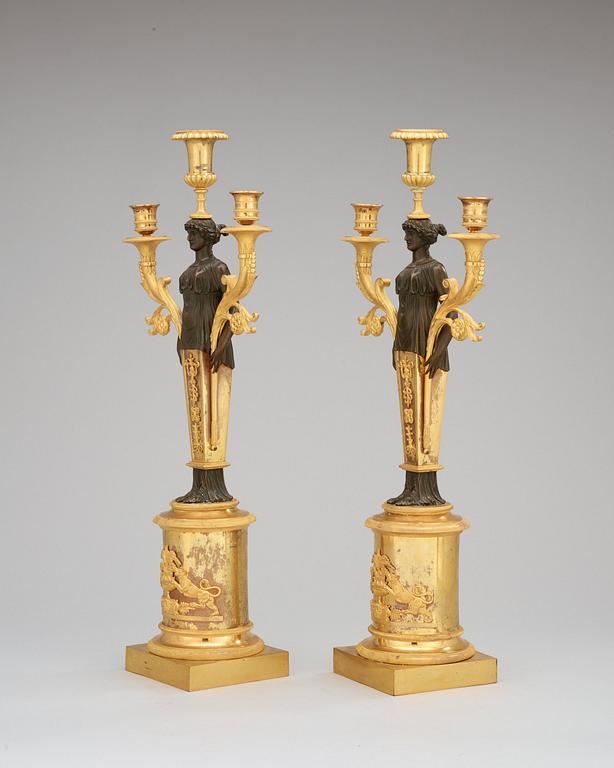 A pair of Swedish Empire early 19th century three-light candelabra.