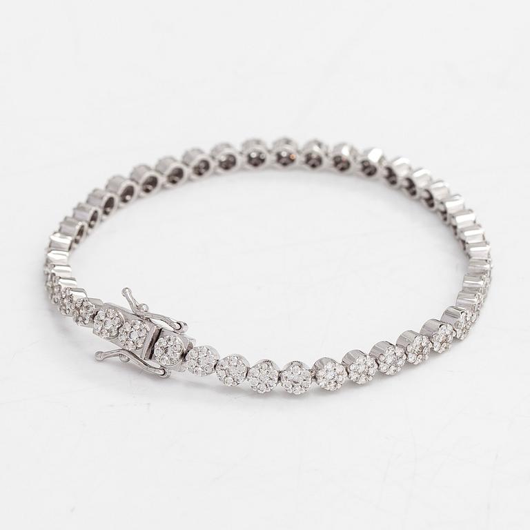 Tennisrannekoru, 18K valkokultaa, timantteja yht noin 3.44 ct. Suomalaiset leimat.