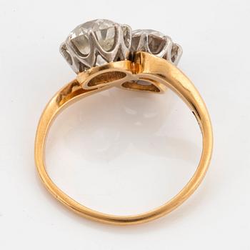 An 18K gold ring set with two old-cut diamonds with a total weight of ca 3.10 cts quality ca J/K si.