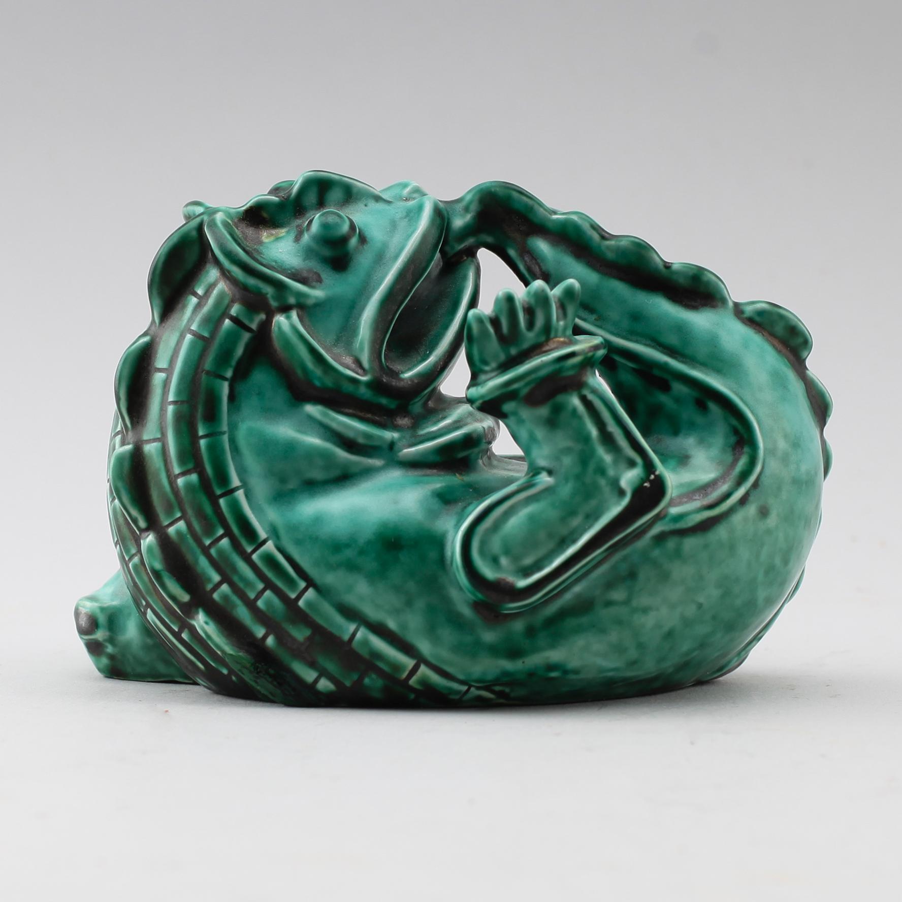 A Wilhelm Kåge stoneware sculpture of a dragon puppy, Gustavsberg ca 1940.