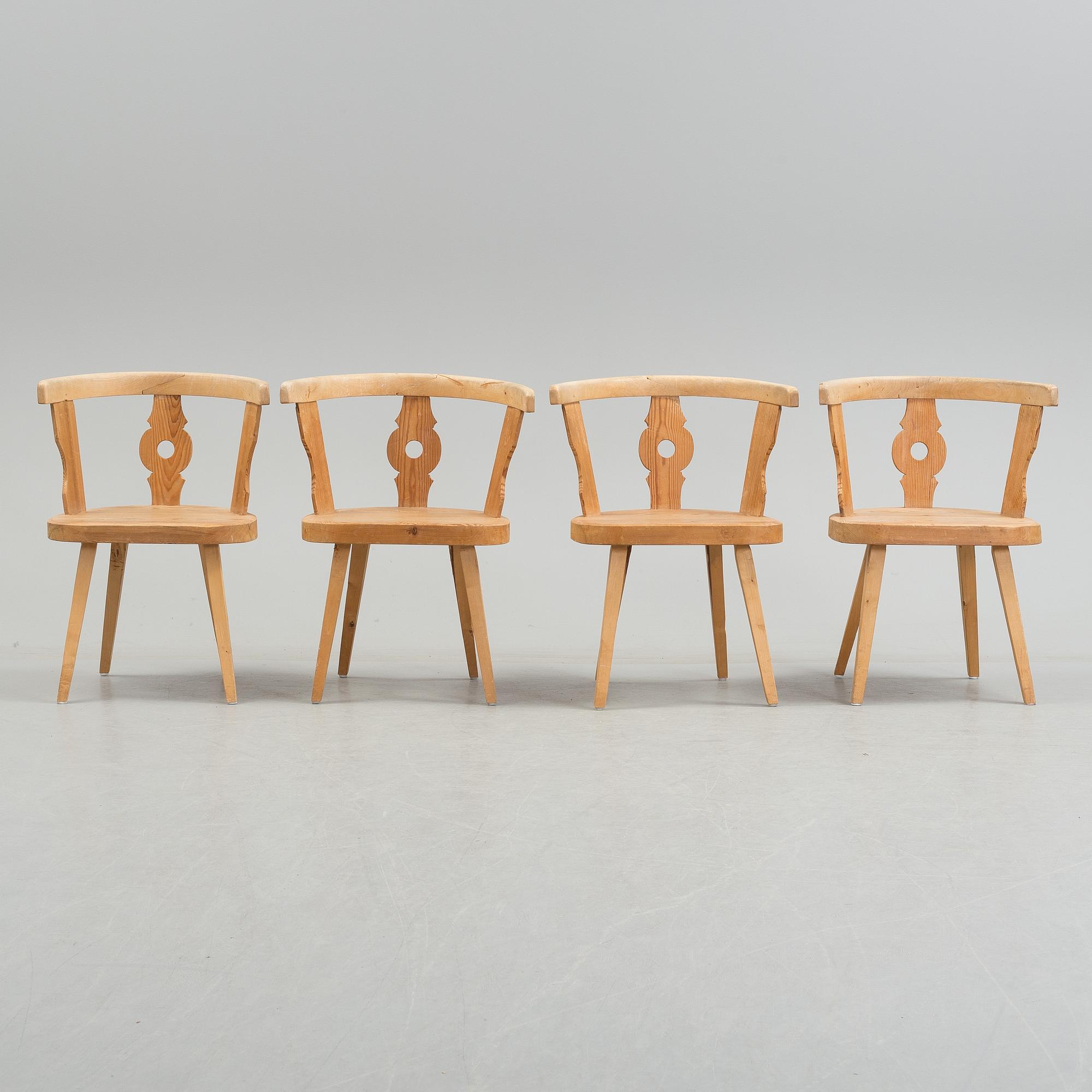 FOUR EARLY 20th CENTURY ARMCHAIRS.