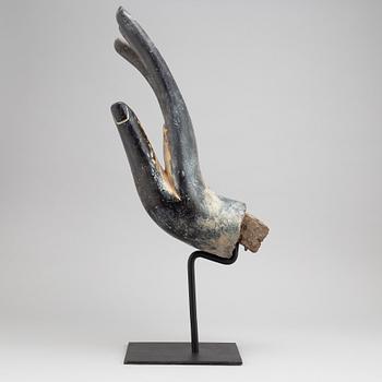 A wooden sculpture of Buddhas hand, Thailand, 20th century.