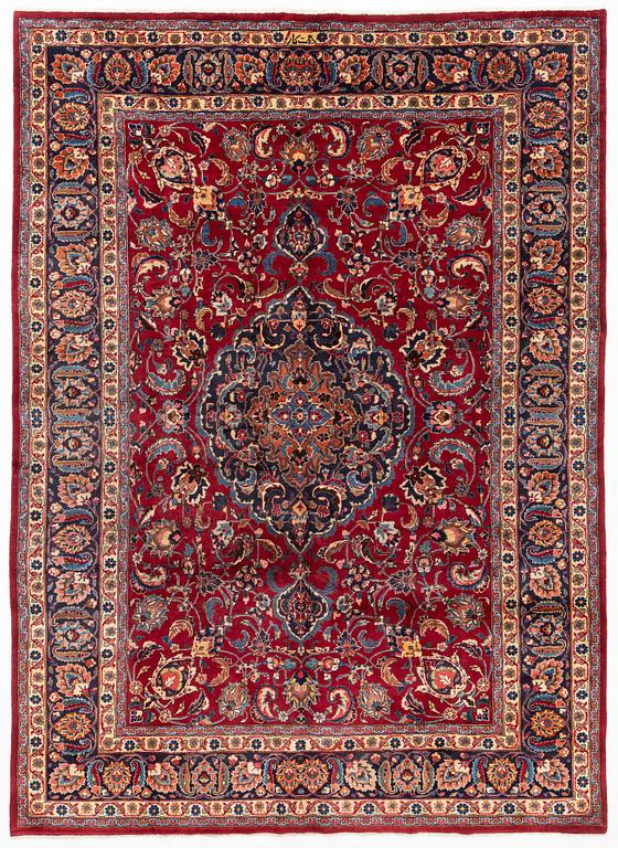 A Mashad carpet, approximately 344 x 245 cm.