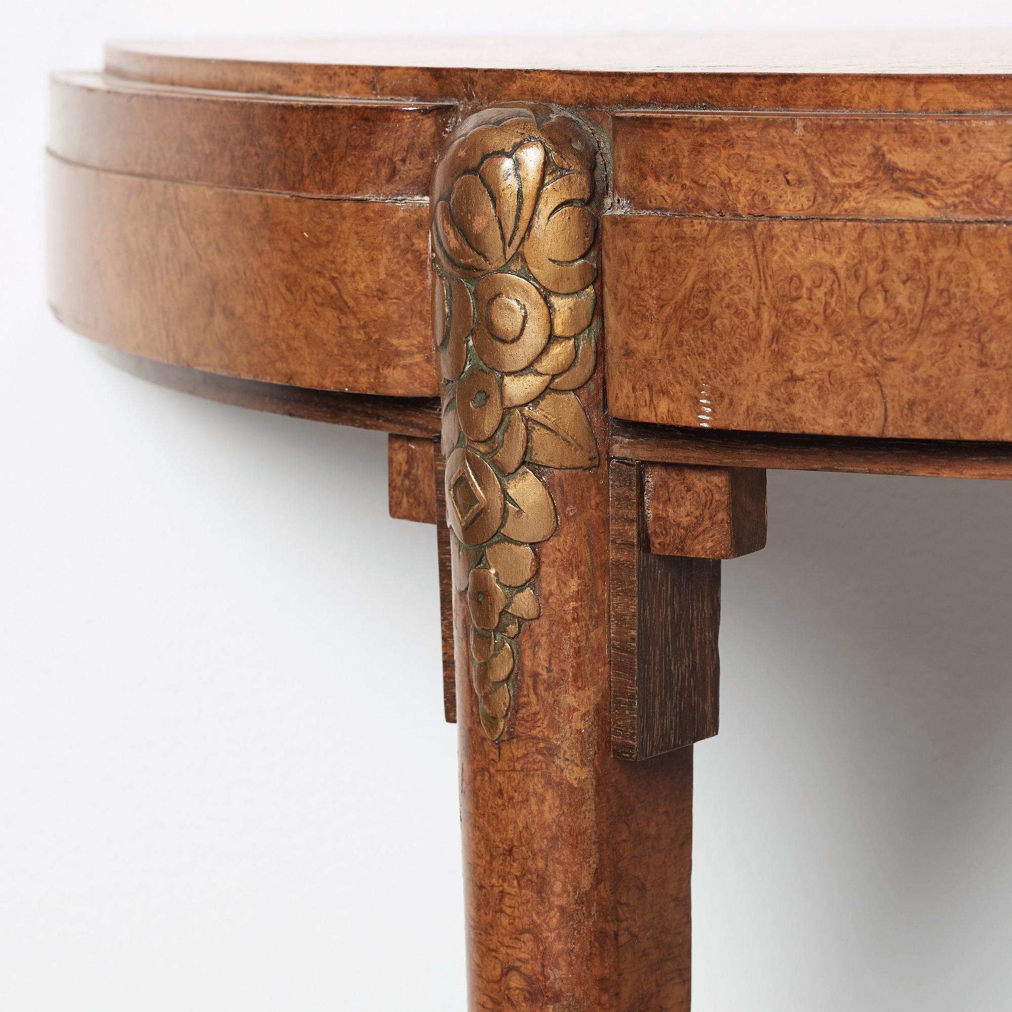 A pair of French Art Déco demi-lune console tables in the manner of Paul Follot, France 1920-30.