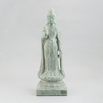 A carved Chinese stone figurine of Guanyin, first half of the 20th century.