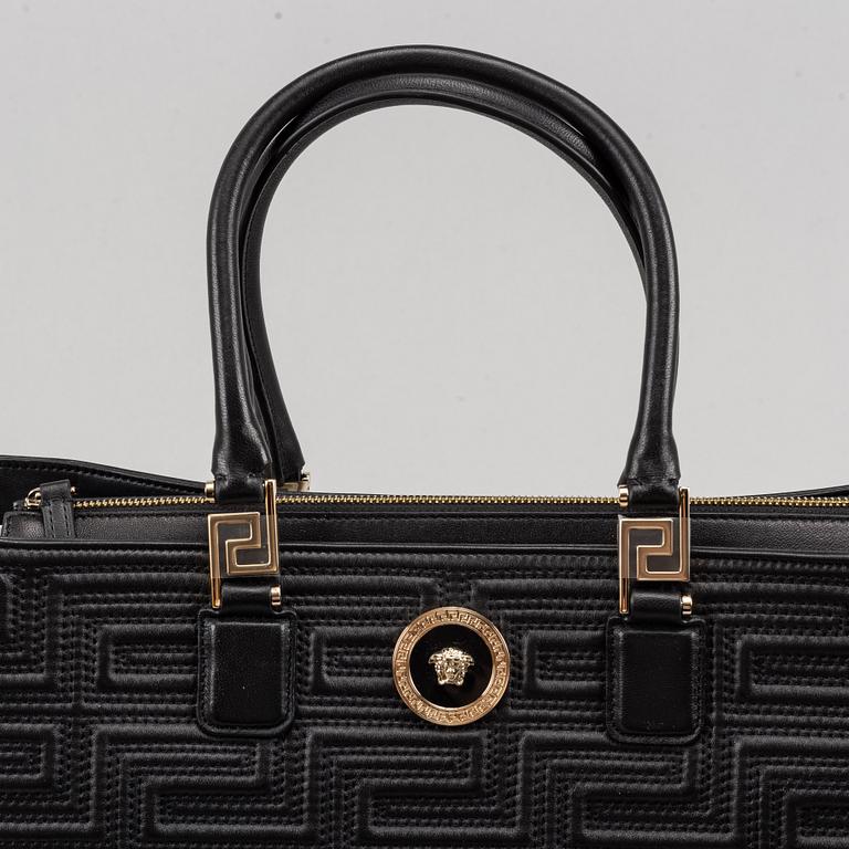 Versace, a black quilted leather handbag.