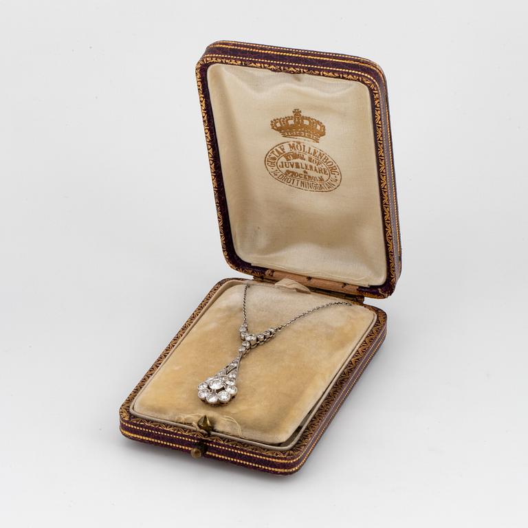 A platinum necklace set with old- and eight-cut diamonds.