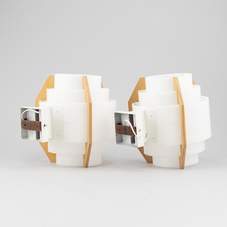 Hans-Agne Jakobsson, a pair of beech and plastic wall light, Markaryd, second half of the 20th century.