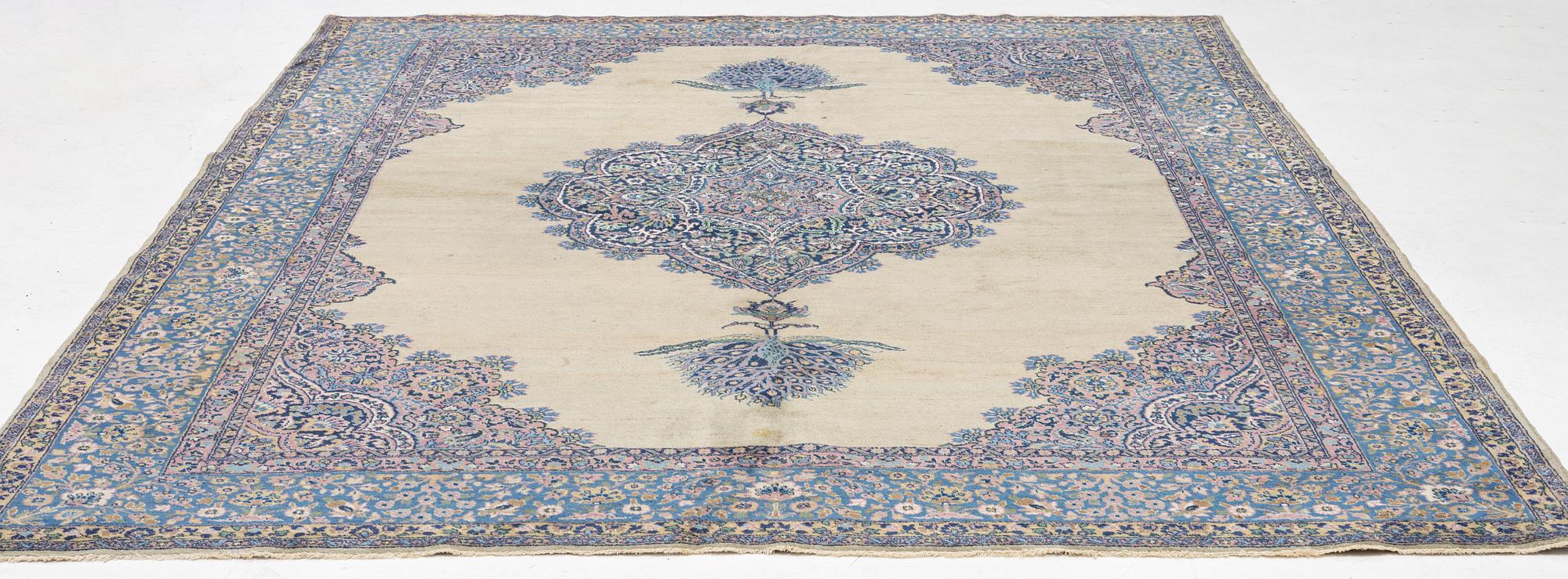 A semi-antique Kerman carpet, figural, c. 371 x 285 cm.