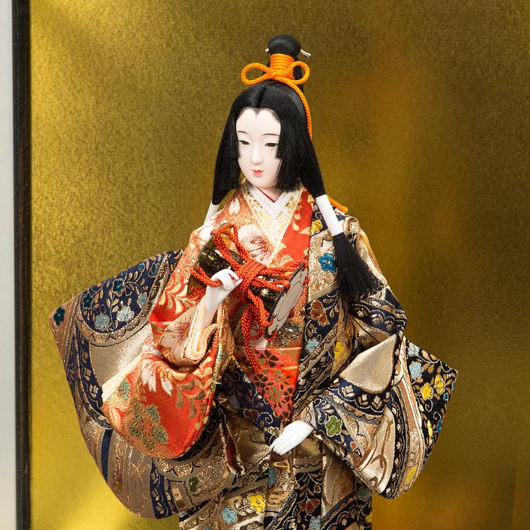 Four late 20th century Japanese dolls.