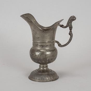 A pewter jug, probably 17th century.