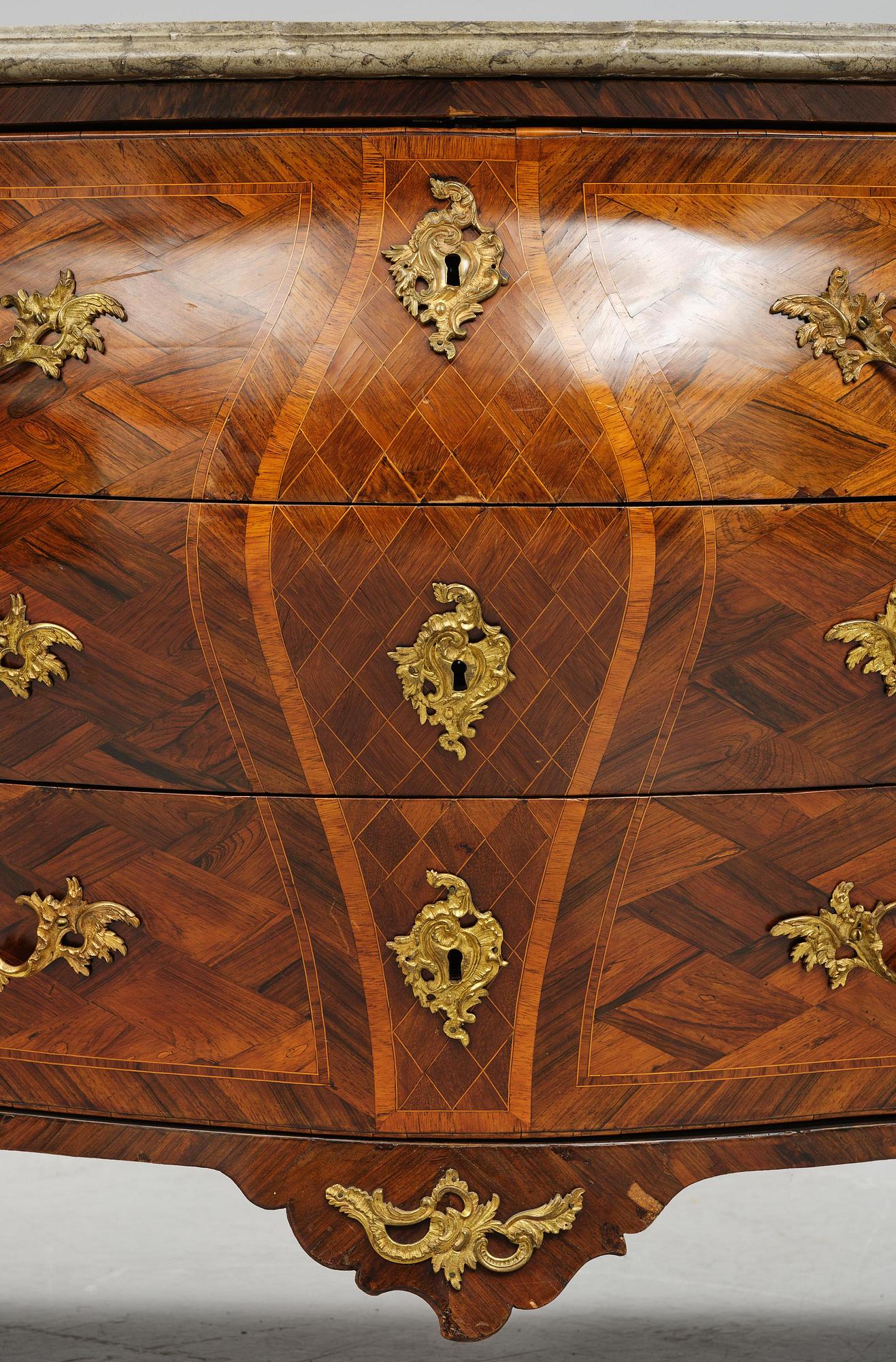 A Swedish rococo parquetry commode attributed to J. Noraeus (master in Stockholm 1769-81).