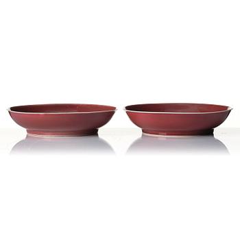 A pair of copper-red dishes, Qianlong mark and of the period (1736-95).