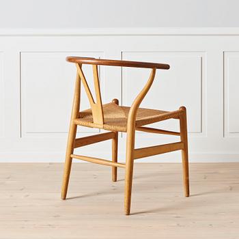 An early oak and teak 'Wishbone chair' by Carl Hansen & Son, Denmark, 1950's.