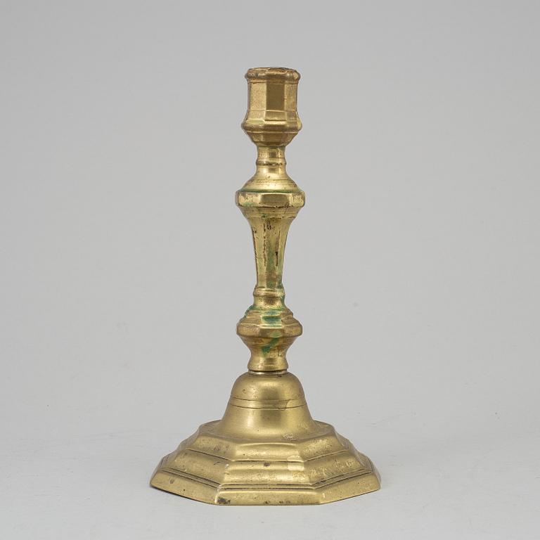 A 18th century bronze candlestick.