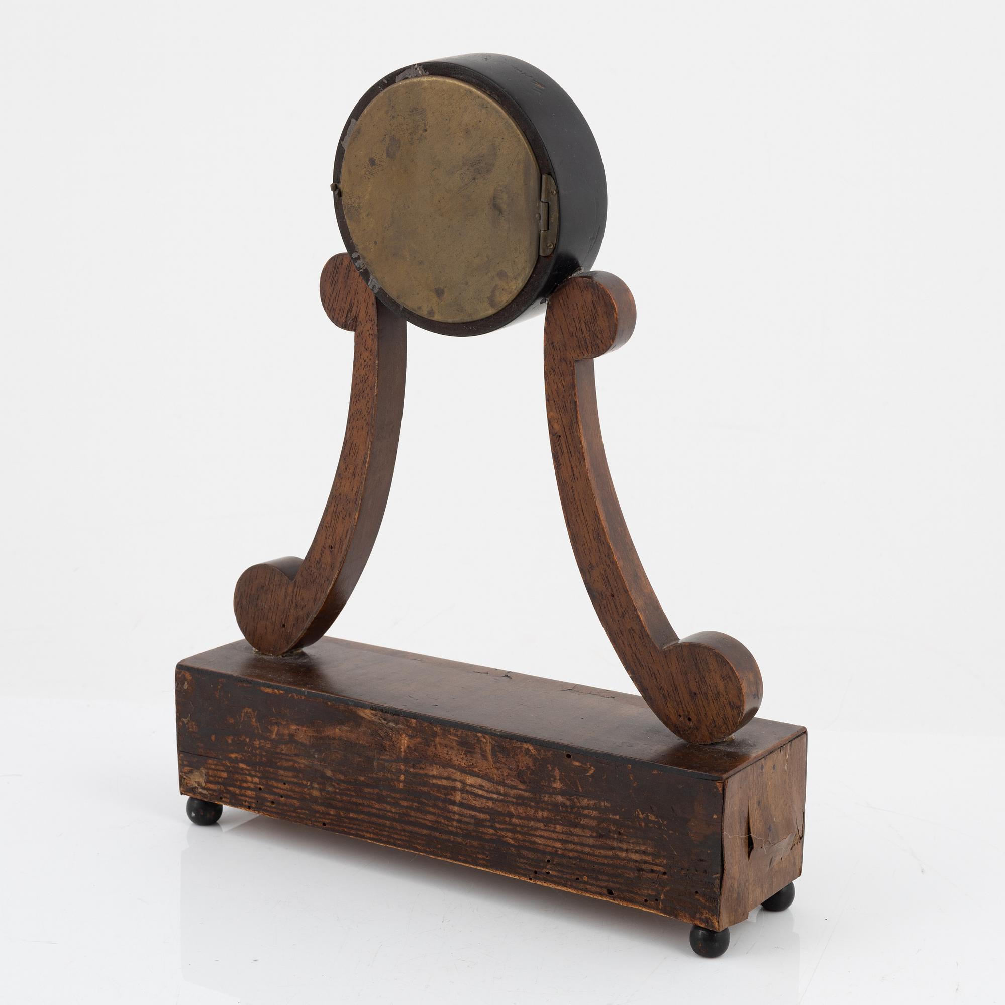 An Empire mantle clock from the 19th century.