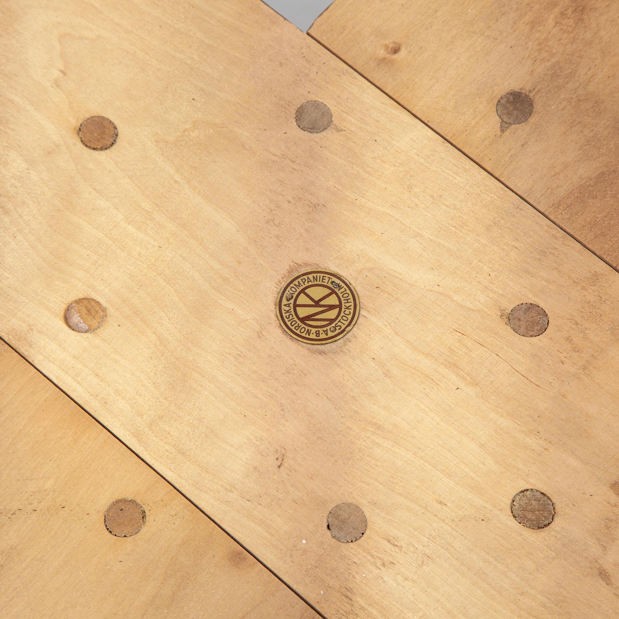 Axel Einar Hjorth, A root veneered dining table, Nordiska Kompaniet, 1938.