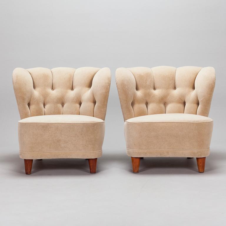 A pair of mid-20th century armchairs.