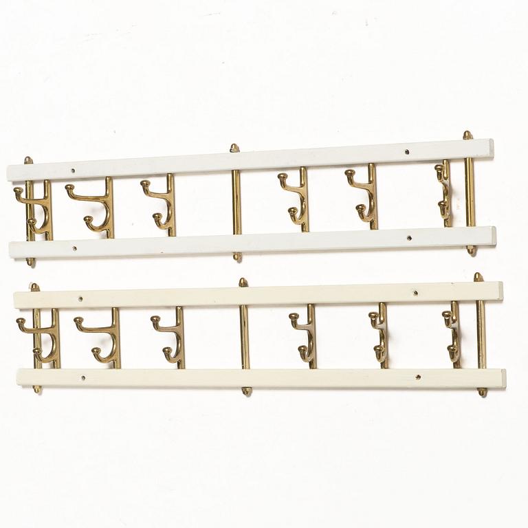 Coat hangers, a pair, “Dekorativ”, Skoglunds Metallgjuteri, Anderstorp, mid-20th century.