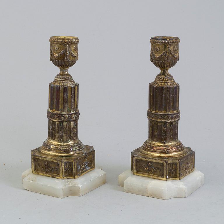 A PAIR OF BRASS AND ALABASTER GUSTAVIAN STYLE CANDLESTICKS, 19th century.