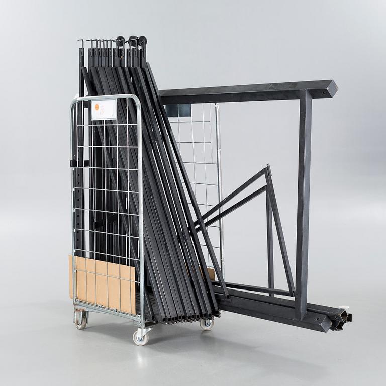 A 21st century showroom rug hanger.