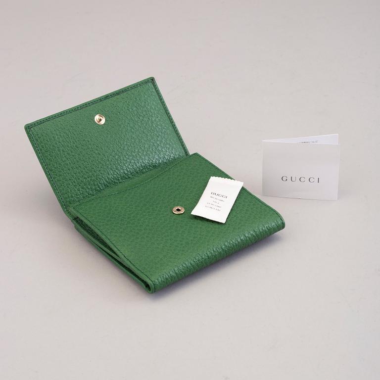 A wallet by Gucci.