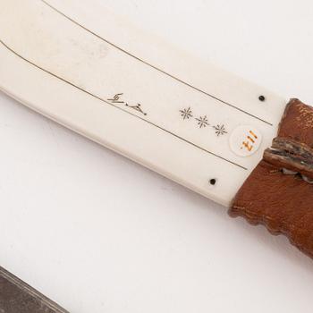 A reindeer horn knife by Svante Larsson before 1999, signed.