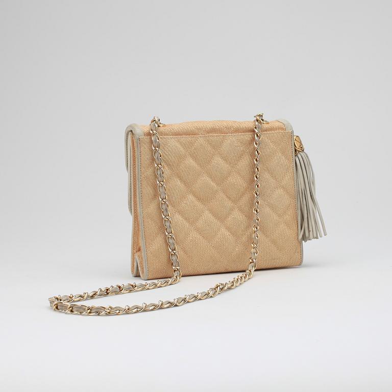 CHANEL, a beige shoulder bag.